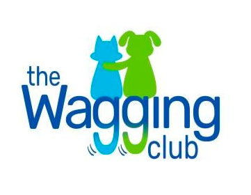 Logo for "The Wagging Club" features a blue cat and green dog standing side by side, with the dog's paw around the cat. The words "Wagging" and "Club" are in blue, with motion lines under the "g." Perfect for a pet resort offering top-notch boarding and grooming services.